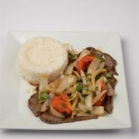 Bistec Encebollado / Beef With Onions, Tomatoes And White Rice · Beef with onions, tomatoes and white rice.