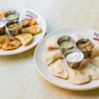 Classic Pierogi · Ukrainian-style dumplings, handmade daily in our kitchen, served boiled or fried with sautée...