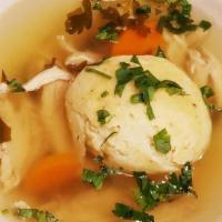 Matzoh Ball · Rich chicken stock with pulled chicken, vegetables and Matzoh dumplings