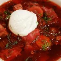 Ukrainian Borscht · Traditional Ukrainian soup. Made with beet stock, roast pork, cabbage, potatoes and lima beans