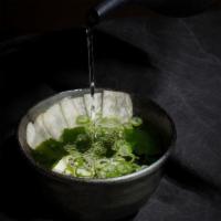 Miso Soup · Soybean broth with soft tofu, dried seaweed, scallions and shiitake mushrooms.