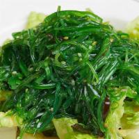 Japanese Seaweed Salad · Green seaweed with sesame seeds.