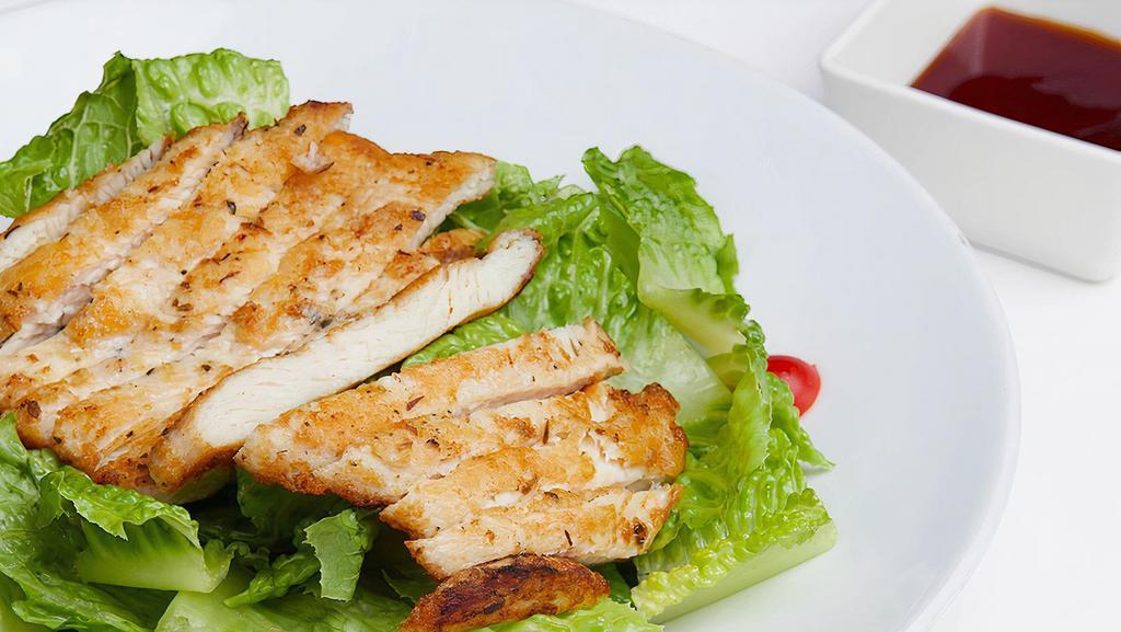 Grilled Chicken Salad · With organic greens.