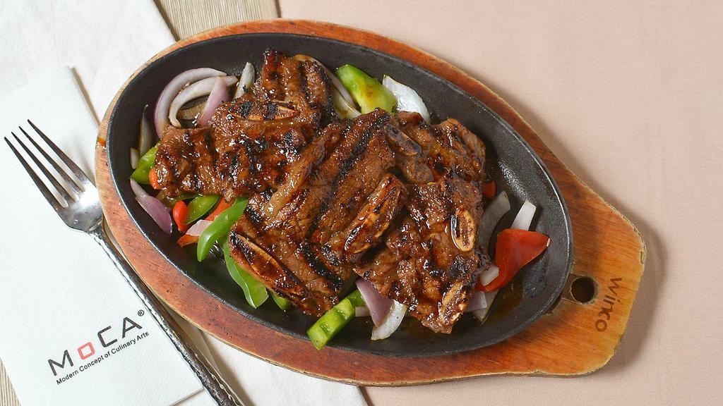 Baby Short Ribs · Korean style grilled marinated baby short ribs, served with field green salad.