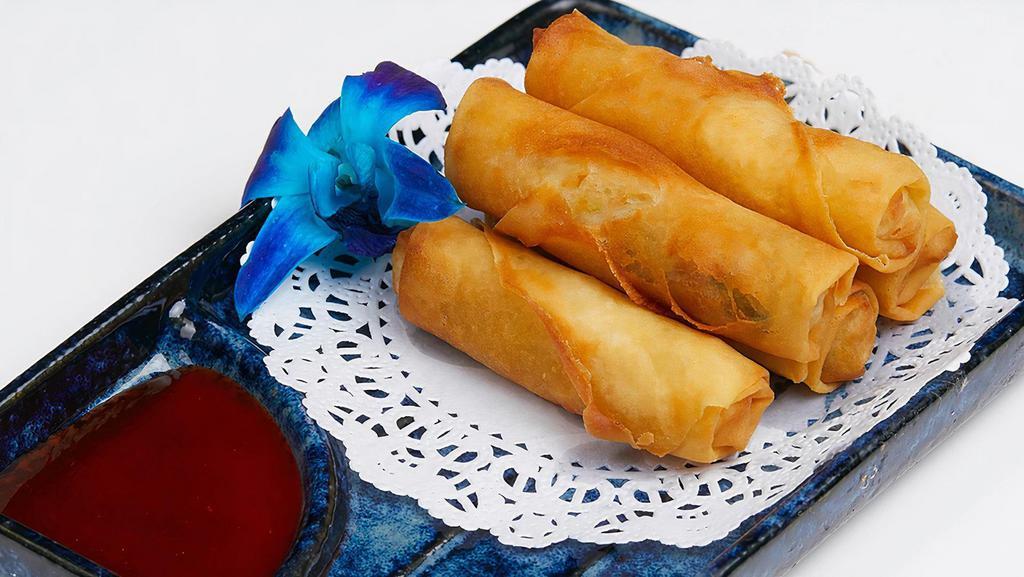 Mini Roll · Crispy vegetable spring rolls with sweet chili sauce.