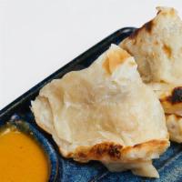 Indian Pancakes  · Traditional Asian style with coconut curry dipping sauce.