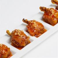 Thai Chicken Lollipop (5) · Crispy chicken wings served with peanut and Thai sweet chili sauce.