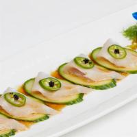 Yellowtail Jalapeno · Spicy. Sliced jalapeno on top of fresh yellowtail and black caviar with citrus soy sauce.