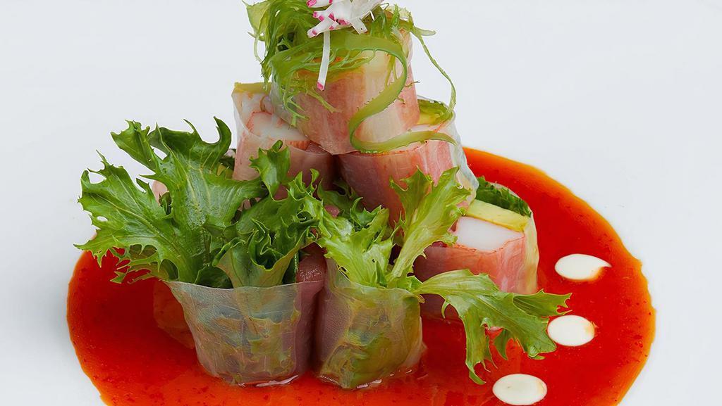 White Tower · Sliced tuna, shrimp, avocado and kani, wrapped with rice paper, with chef's special sauce.