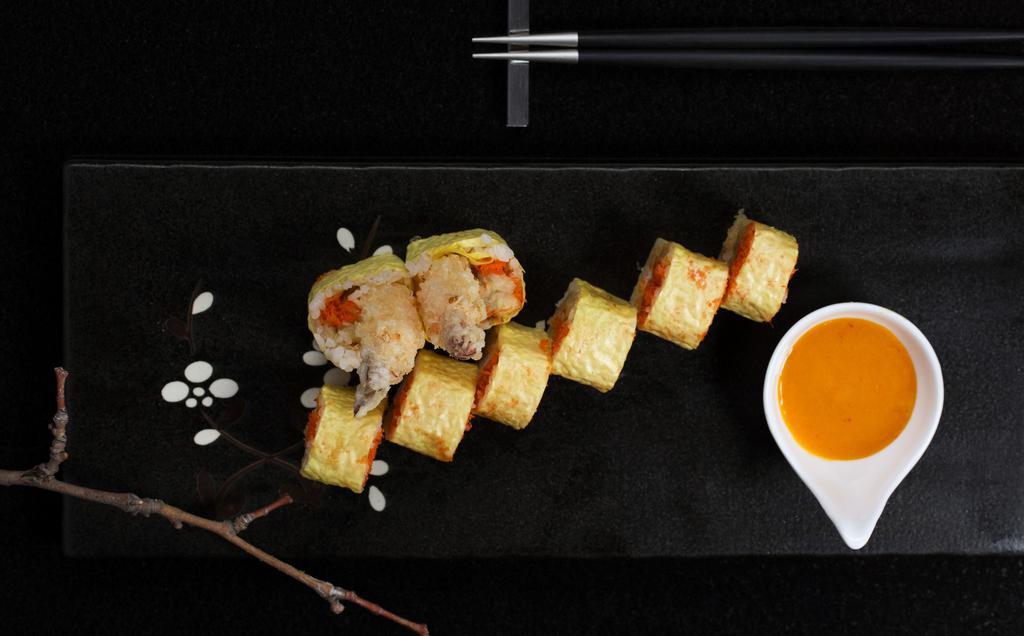 Paradise Roll · Fried banana, spicy snow crab, shrimp tempura with soy bean paper, served with mango chili sauce.