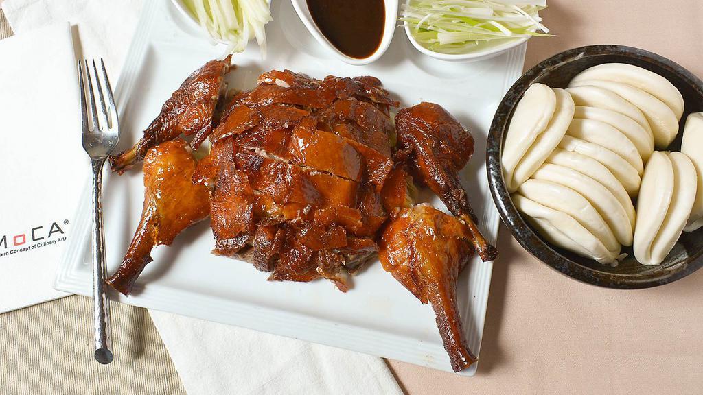 Moca Roasted Peking Duck (Full)  · Peking style roasted duck served with steamed mini buns and hoisin sauce.