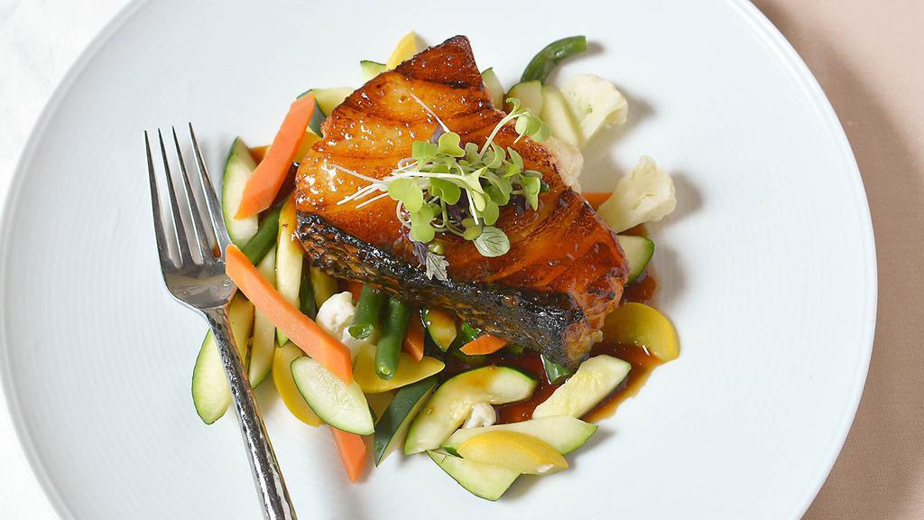 Char Grilled Chilean Sea Bass · Marinated sea bass with chef's miso sake dressing served with sauteed mixed vegetables.
