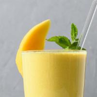 Mighty Mango Smoothie · Refreshing smoothie with mango, strawberries, and banana.