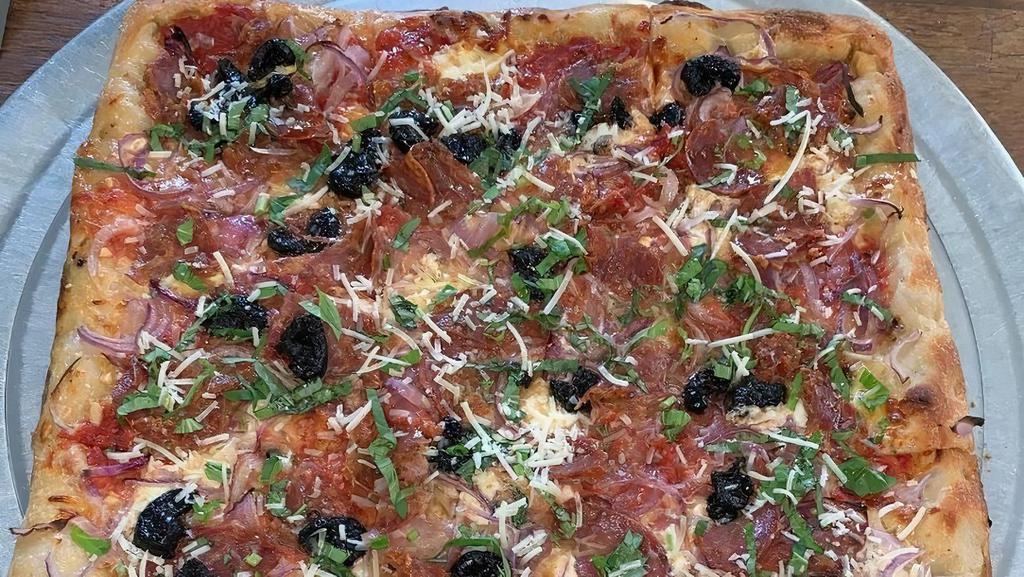 Calabrese · Red onions, sopressata, imported black olives, basil, parmigiano-reggiano, fresh mozzarella and tomato sauce.