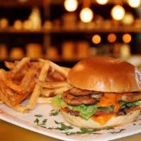 Bohemian Burger · Crispy chicken breast, lettuce, tomato, grilled onions, mozzarella cheese, honey mustard. Se...