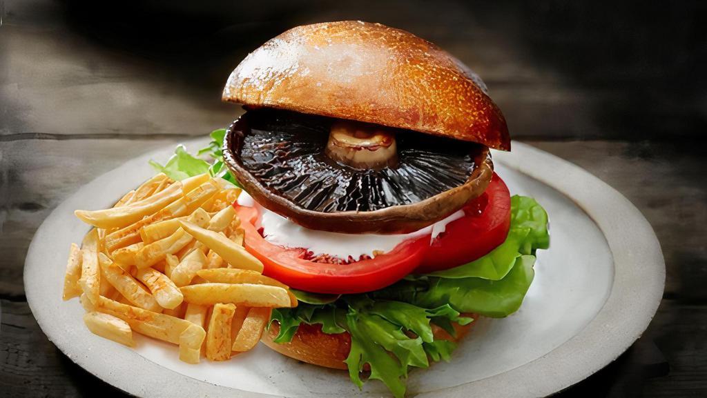 Holly Burger · Mushrooms, grilled onions, tomato and lettuce topped with Swiss cheese. Served with french fries.