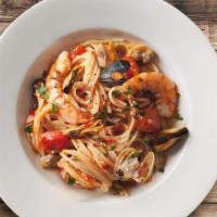 Seafood Pasta · Mix of shrimps, mussels, clams, calamari with linguine in a tomato sauce and basils.