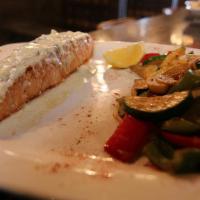 Salmon Fillet · Pan seared fresh salmon served with creamy sauce.