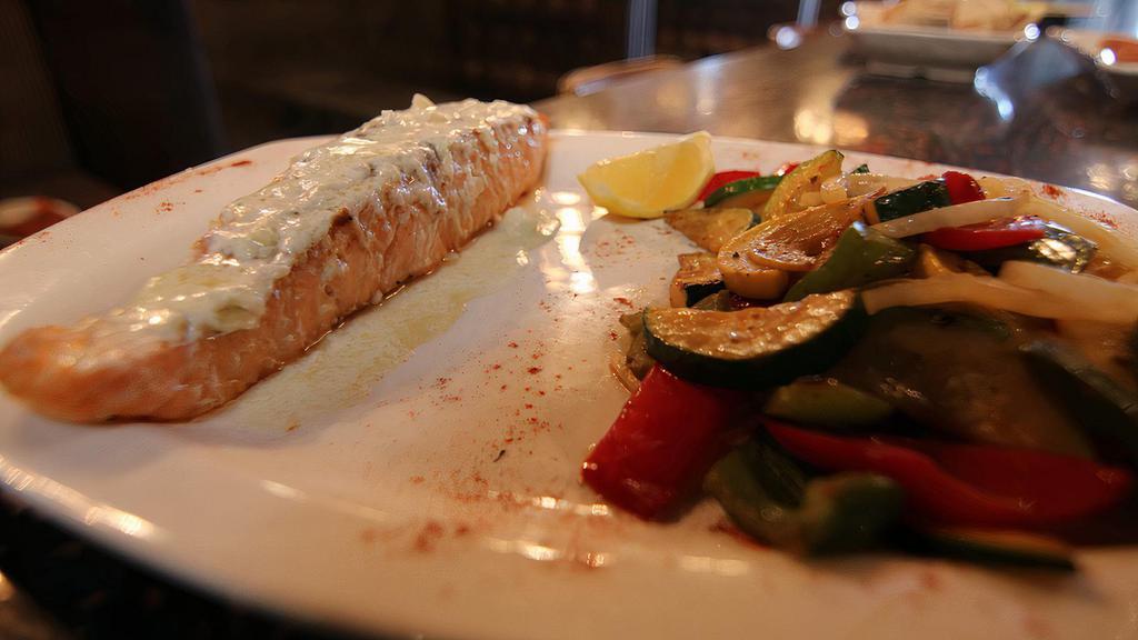 Salmon Fillet · Pan seared fresh salmon served with creamy sauce.