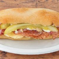  Cuban Sandwich · Ham, slow roasted pork, Swiss, pickles and mustard topped with MOJO. Served with pickle and ...