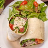 Chicken Salad Wrap · Our homemade granny smith apple, cranberry chicken salad with spring greens, and sliced toma...