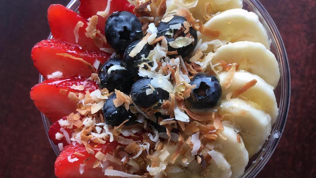 Acai Bowl · Made with soy milk, blueberries, strawberries, and bananas. Topped with fresh strawberries, bananas, blueberries, honey, granola, and toasted coconut.