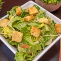 Caesar Salad · Chopped Romaine lettuce, Parmesan  Cheese, Caesar dressing tossed and topped with croutons.