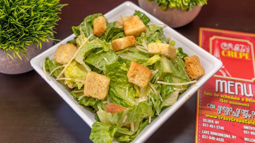 Caesar Salad · Chopped romaine lettuce, parmesan cheese, caesar dressing tossed, and topped with croutons.
