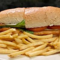 Fish Sandwich With French Fries · Sandwich made with a piece of cut fish that is either fried, baked, or grilled.