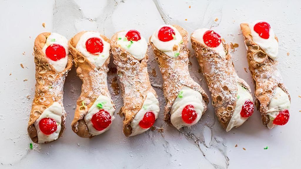 Large Cannoli · Fresh circos cannoli shell filled to order with signature ricotta cream with chocolate chips. Topped with powder sugar.