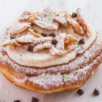 Holy Cannoli Donut · Filled with signature ricotta cream with chocolate chips and topped without crushed cannoli ...