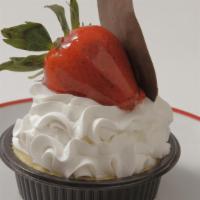 Ny Cheesecake Cup · NY style cheesecake topped with whipped cream and a fresh strawberry.