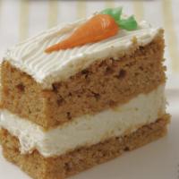 Carrot Cake Slice · Carrot cake with golden raisins, cinnamon, and other secret spices. Filled with a cream chee...