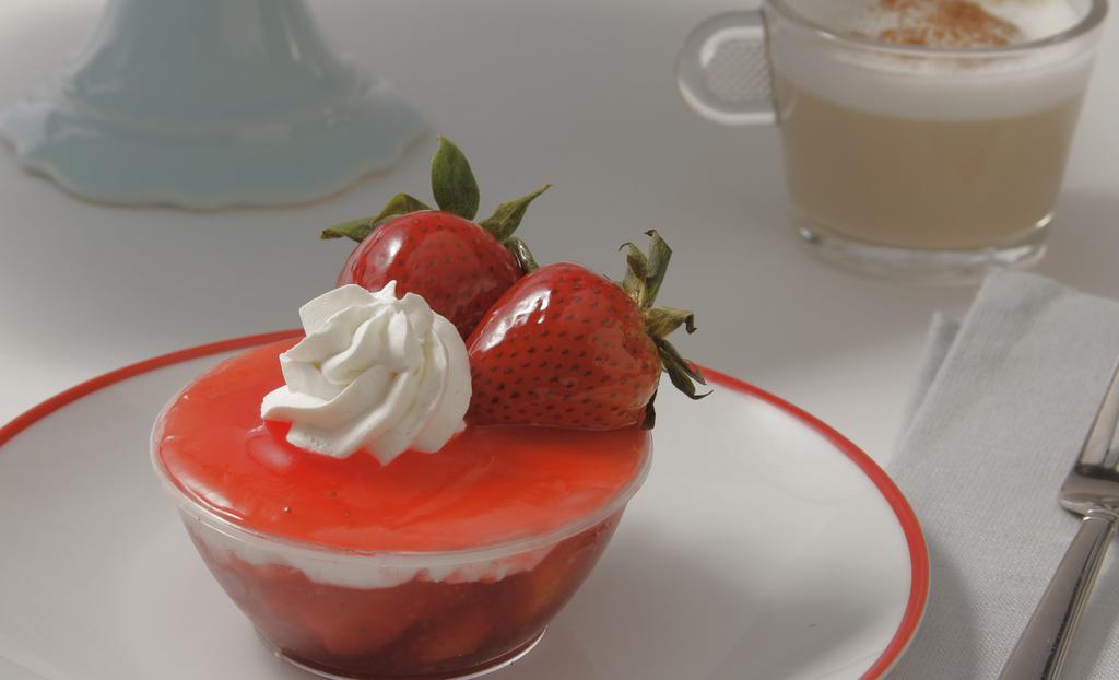 French Vanilla & Strawberry Cup · Our light and fluffy French Vanilla cream with strawberry filling topped with our strawberry glassy and 2 fresh strawberries.
