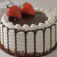 Chocolate Strawberry Banana Cake · Seven inches serves 8 to 10. Chocolate cake with a layer of fresh bananas and a layer with s...