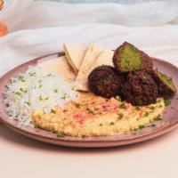 Hummus Falafel Plate · Hummus with falafel and chopped parsley, drizzled with olive oil and topped with a sprinkle ...