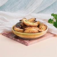 Roasted Potatoes · Roasted potatoes tossed with chopped parsley and olive oil.