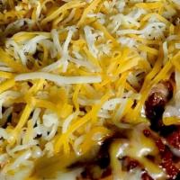 Bowl Of Texas Chili · Authentic Texas Chili topped with cheese & onion served with fresh bread