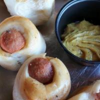Dogs In Dough · All beef natural casing Sabrett hot dogs wrapped & baked in our pizza dough