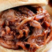 1/4 Lb. Pulled Pork Slider · in-house smoked pulled pork, BBQ sauce on a Martin potato roll