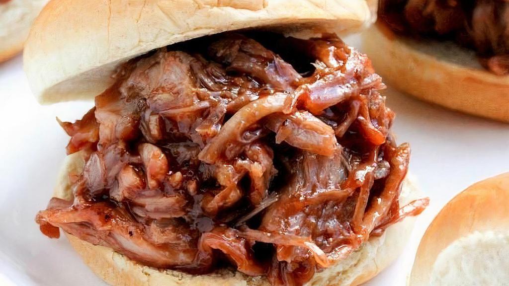 1/4 Lb. Pulled Pork Slider · in-house smoked pulled pork, BBQ sauce on a Martin potato roll
