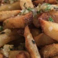 Garlic Truffle Fries · baked Idaho potatoes hand cut & fried tossed in fresh garlic, truffle oil, peccorino romano