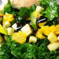 Kale Avoccado Salad · Fresh cut kale topped with apples, sweet oranges and avocado with homemade honey lemon dress...
