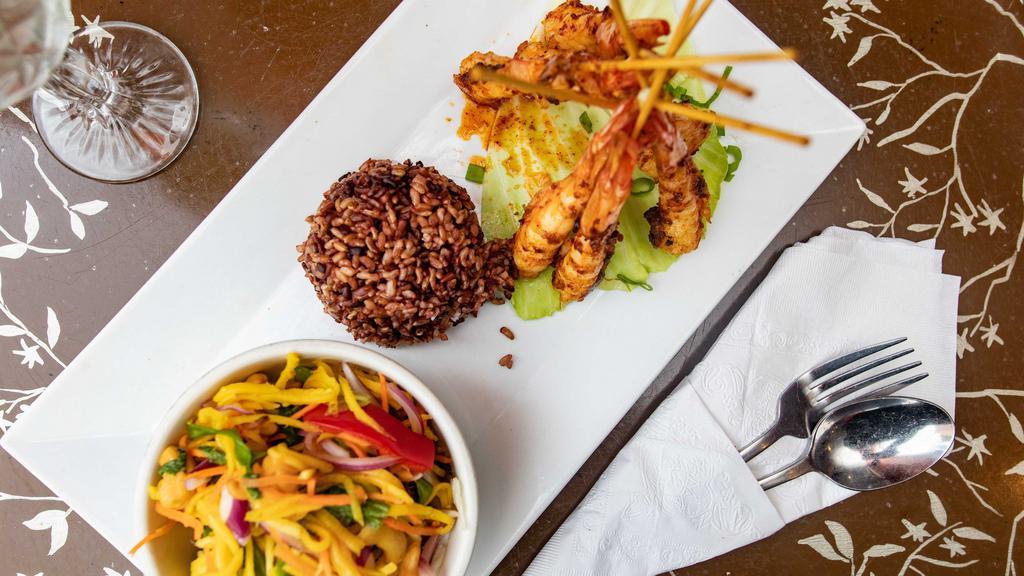 Sp15. Grilled Jumbo Shrimp (Thai Style) · Spicy. Grilled marinated jumbo shrimp with Thai chili paste served with mango salad and sticky rice.