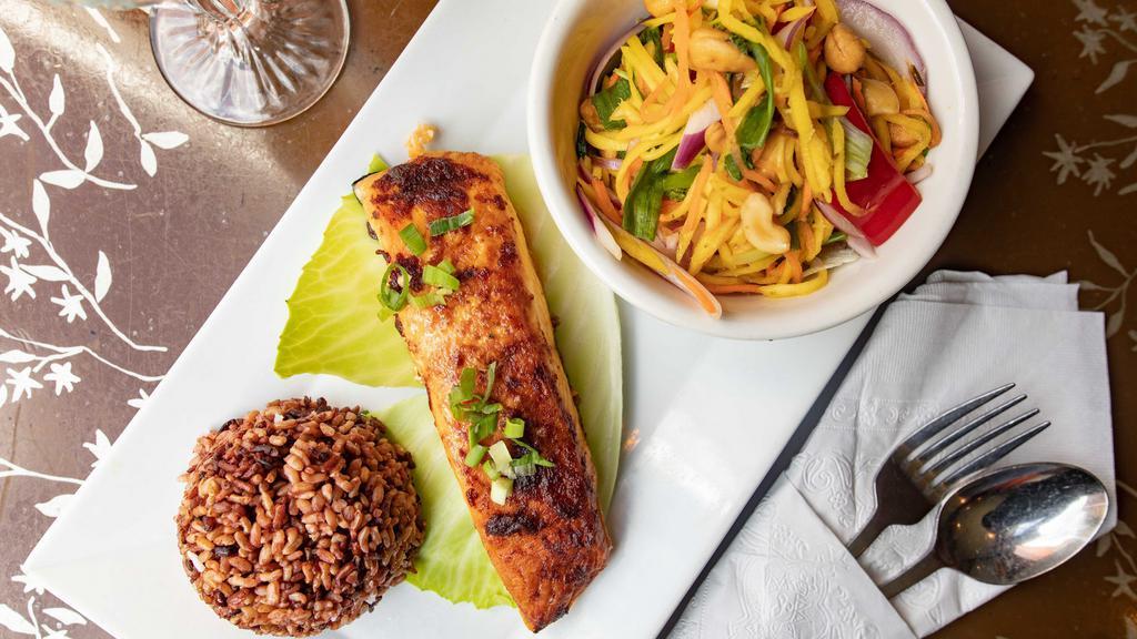 Sp14. Mango Salmon · Spicy. Grilled salmon served with mango salad and sticky rice.