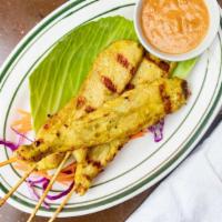 Grilled Chicken Or Beef Satay · Grilled marinated chicken or beef on skewers served with peanut sauce and cucumber relish. C...