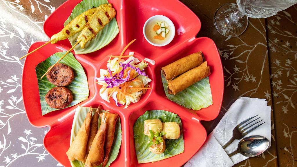 Red Basil Combo · Combination of spring roll, Thai sui mai, fried shrimp roll, Thai fish cake, and grilled chicken satay.