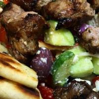 Pork Souvlaki Plate · Served with Brown Rice, Grilled Peppers & Onions, Pita & Tzatziki. Served with 2 sides.