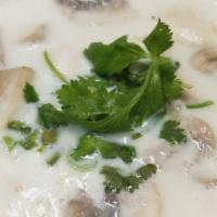 Tom Kha Chicken Soup · With mushroom, coconut milk and galanga.