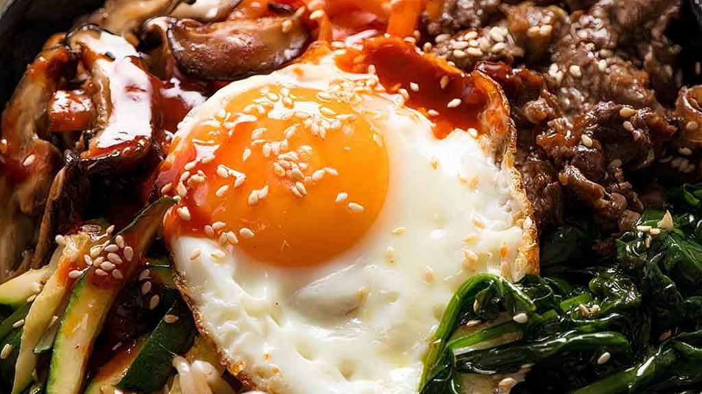 Bibimbap · Rice topped with assorted vegetables, sesame oil, gochujang, and a fried egg. Add in some Bulgogi for extra protein!